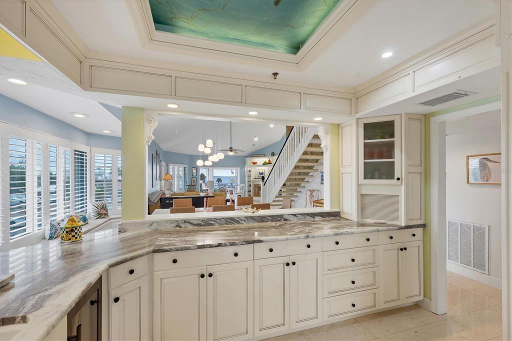 11000 Placida Road, Unit 2103 Placida, FL 33946 - Photo 16 of 63 a bathroom with a granite countertop sink and a large mirror