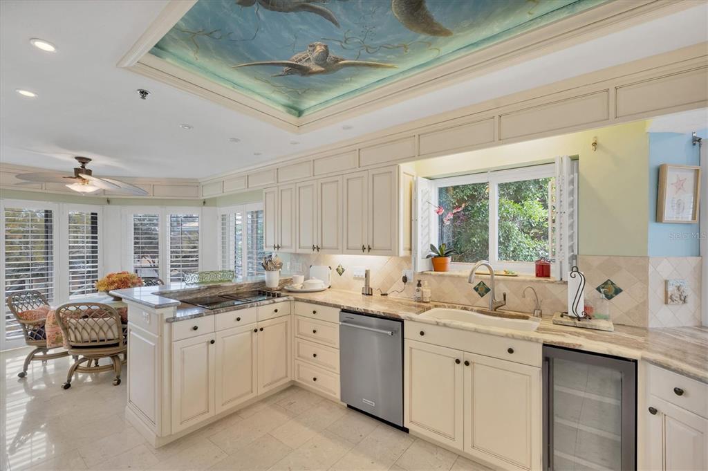 11000 Placida Road, Unit 2103 Placida, FL 33946 - Photo 17 of 63 a kitchen with a sink window and cabinets