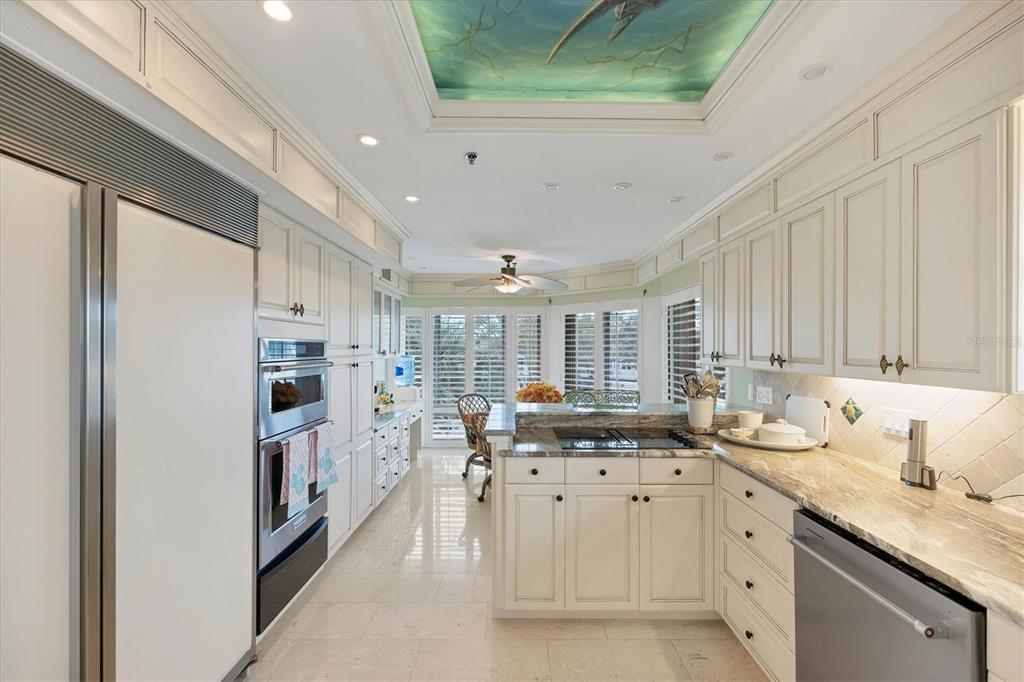 11000 Placida Road, Unit 2103 Placida, FL 33946 - Photo 18 of 63 a kitchen with refrigerator and cabinets