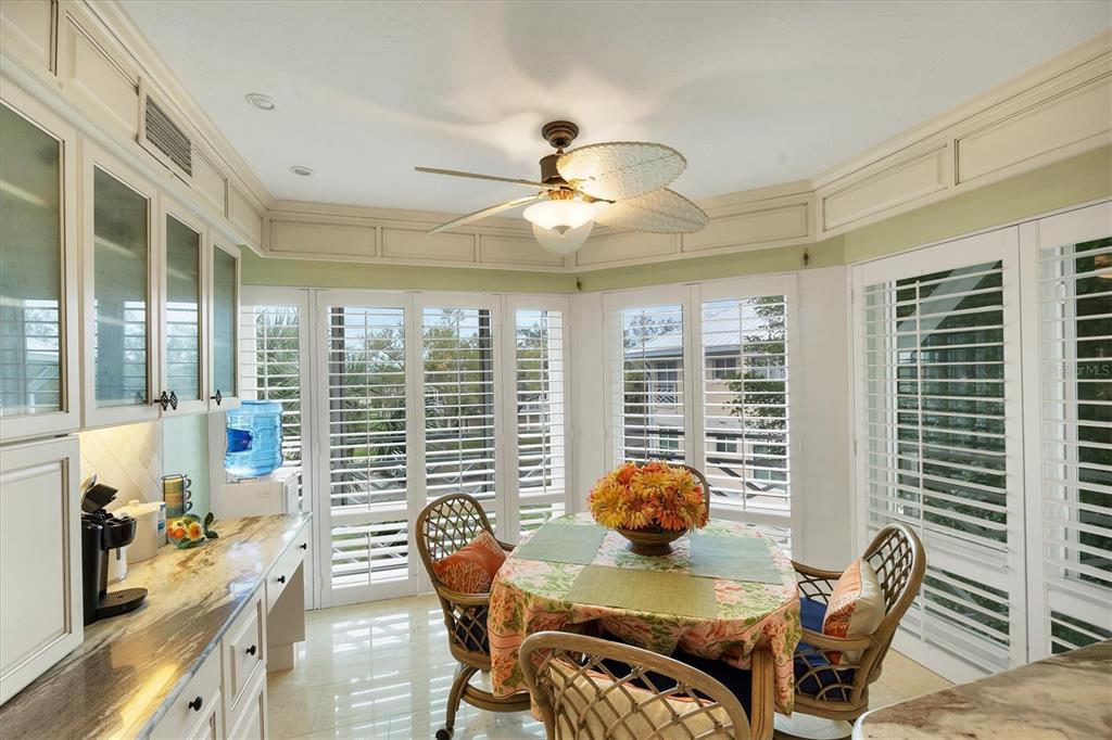11000 Placida Road, Unit 2103 Placida, FL 33946 - Photo 21 of 63 a living room with furniture and floor to ceiling windows