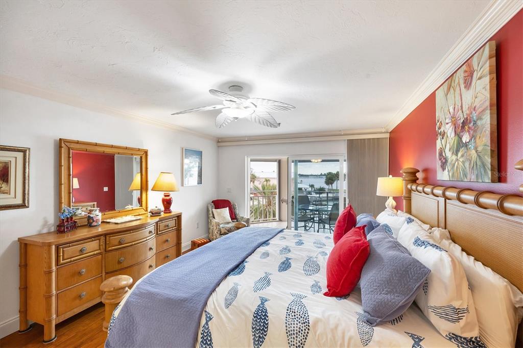 11000 Placida Road, Unit 2103 Placida, FL 33946 - Photo 24 of 63 a bed room with a bed and a dresser