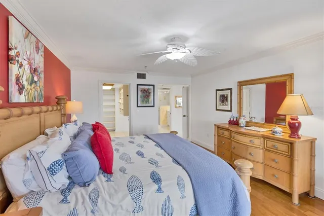 a bedroom with two bed and a window