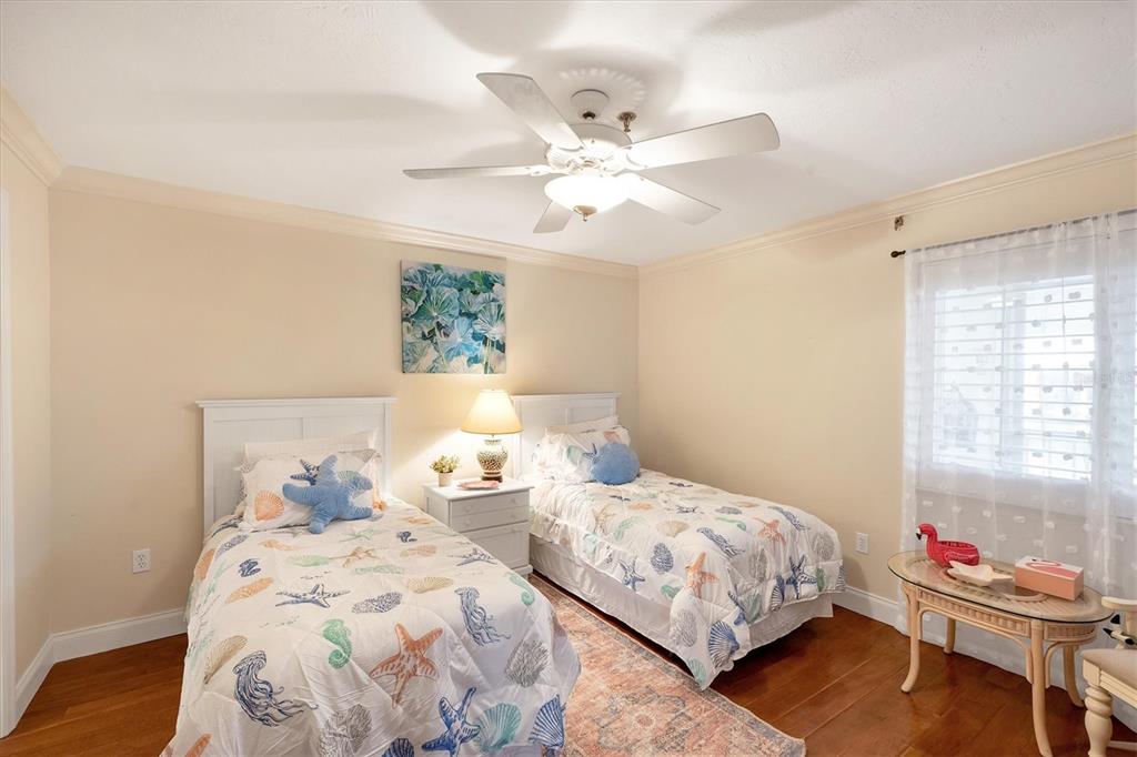 11000 Placida Road, Unit 2103 Placida, FL 33946 - Photo 29 of 63 a bedroom with two bed and a window