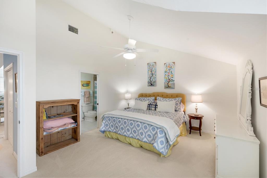 11000 Placida Road, Unit 2103 Placida, FL 33946 - Photo 36 of 63 a bedroom with a bed and a lamp