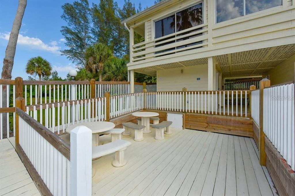 11000 Placida Road, Unit 2103 Placida, FL 33946 - Photo 51 of 63 a view of a balcony with wooden floor