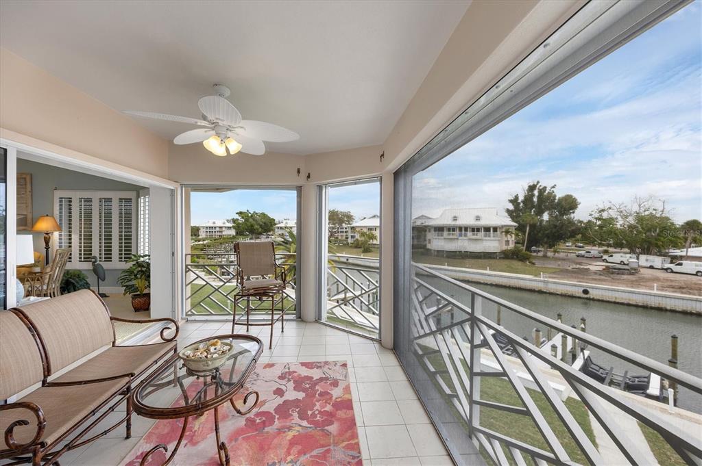11000 Placida Road, Unit 2103 Placida, FL 33946 - Photo 10 of 63 a living room with furniture and a large window