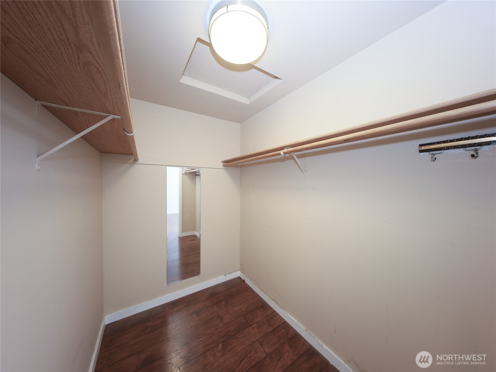 3413 Alaska Road Brier, WA 98036 - Photo 15 of 26 a view of a room with wooden floor and white walls