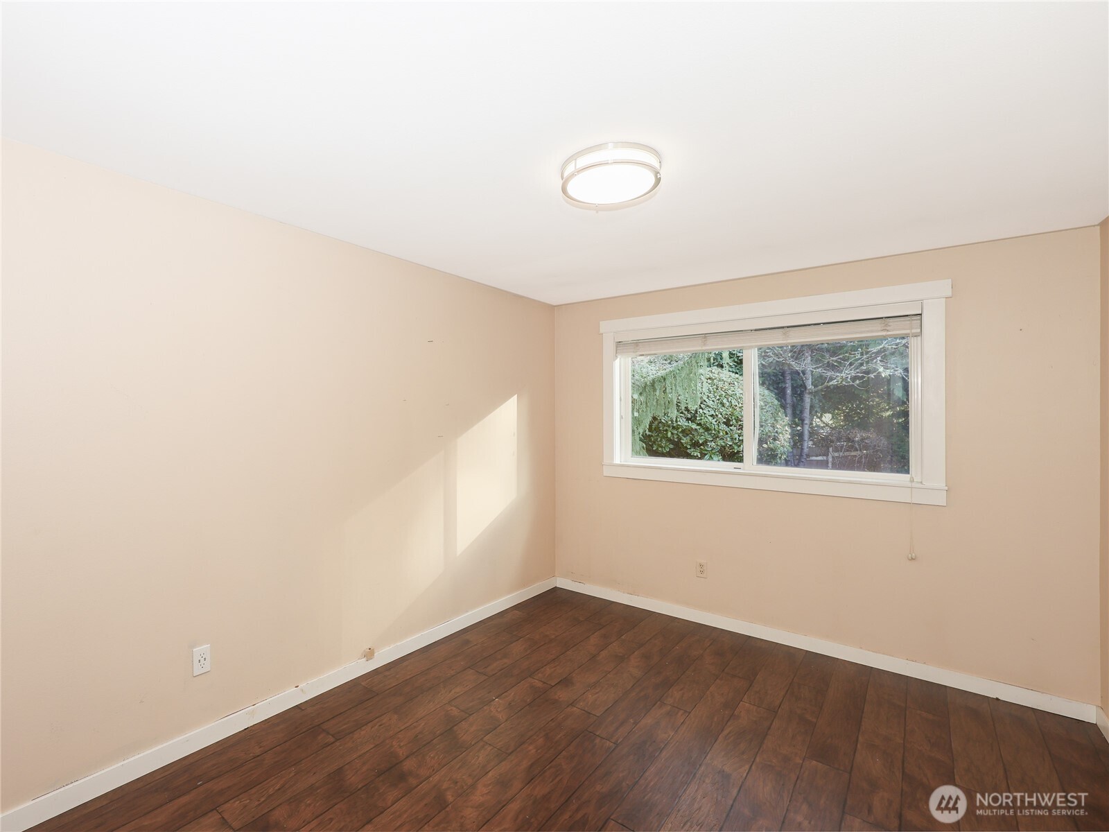 3413 Alaska Road Brier, WA 98036 - Photo 16 of 26 an empty room with wooden floor and windows