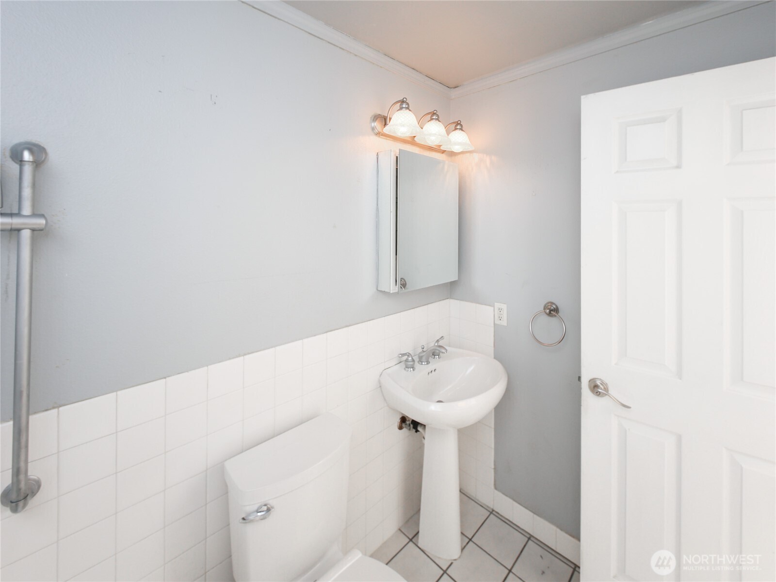 3413 Alaska Road Brier, WA 98036 - Photo 19 of 26 a bathroom with a sink a mirror and toilet