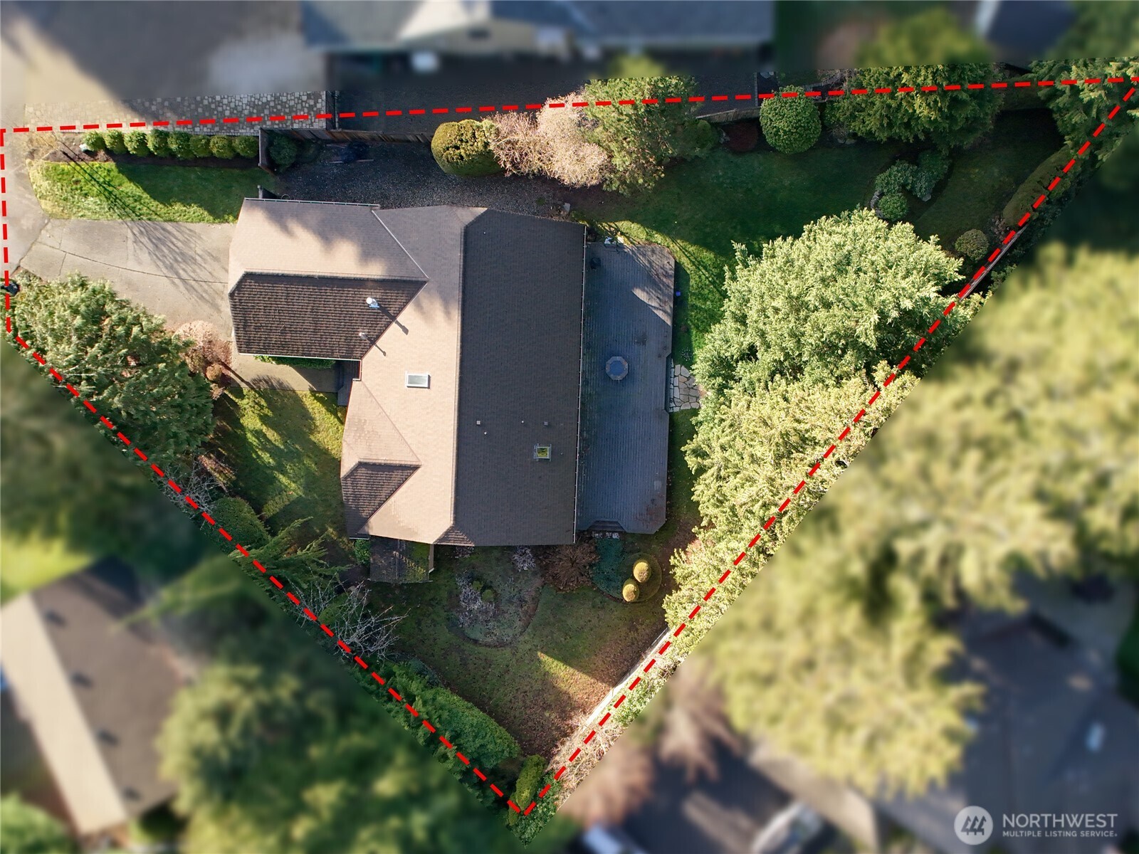 3413 Alaska Road Brier, WA 98036 - Photo 2 of 26 an aerial view of a house with a yard and garden