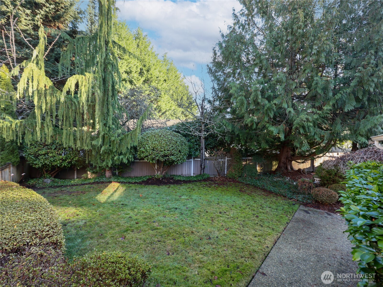 3413 Alaska Road Brier, WA 98036 - Photo 22 of 26 a view of a backyard with a garden