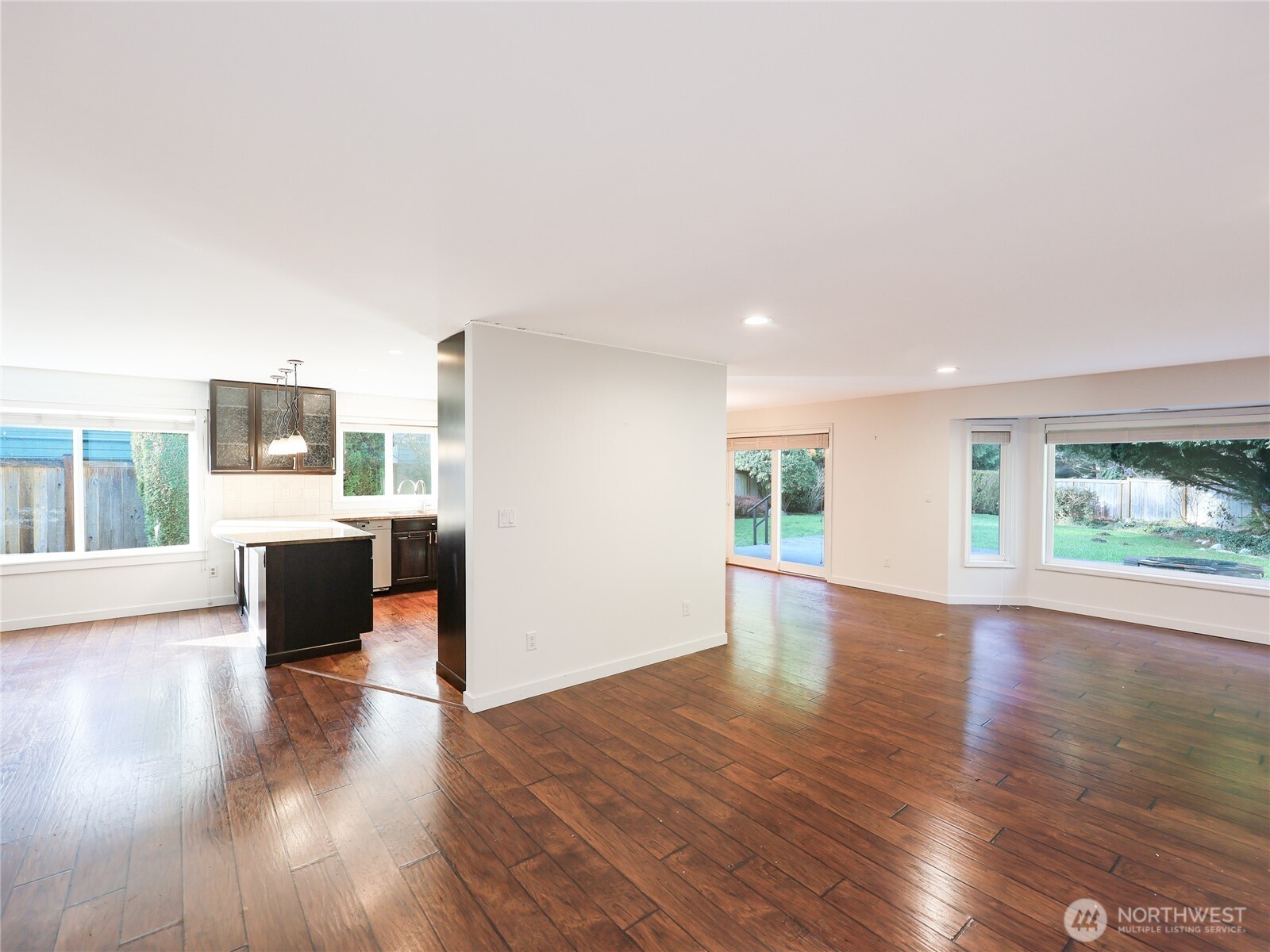 3413 Alaska Road Brier, WA 98036 - Photo 4 of 26 a view of an empty room with wooden floor and a window