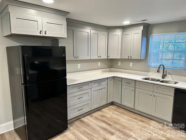 a kitchen with a sink and cabinets
