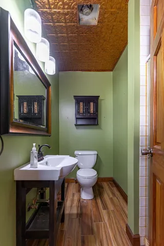a view of an empty room with stairs and a couch
