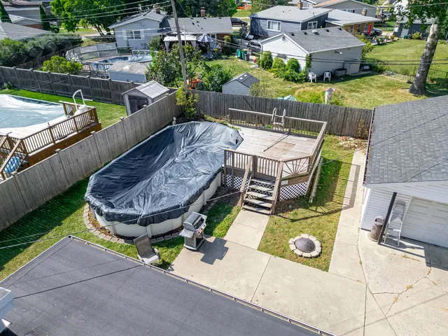 an aerial view of a house with outdoor space