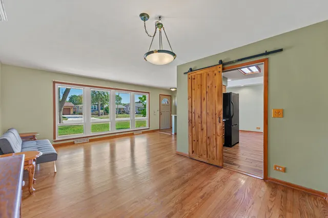 a view of an entryway with wooden floor