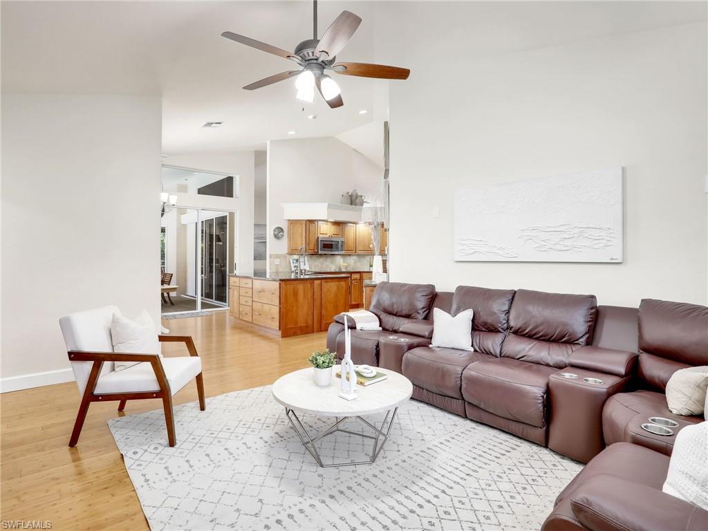 6862 Mill Run Road Naples, FL 34109 - Photo 19 of 50 Living room with ceiling fan and light hardwood / wood-style floors
