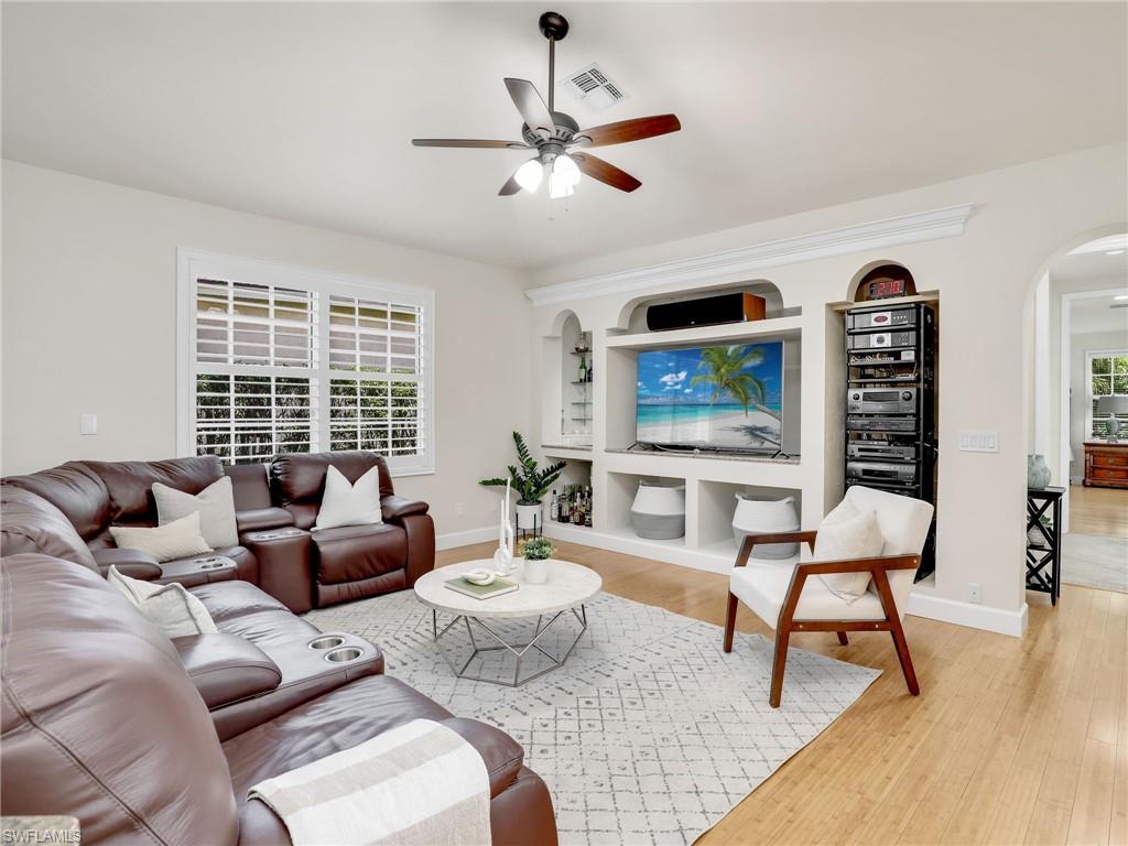 6862 Mill Run Road Naples, FL 34109 - Photo 20 of 50 Living room with ceiling fan, light hardwood / wood-style flooring, and vaulted ceiling