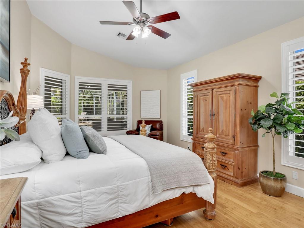 6862 Mill Run Road Naples, FL 34109 - Photo 23 of 50 Bedroom with ceiling fan, high vaulted ceiling, and light hardwood / wood-style flooring