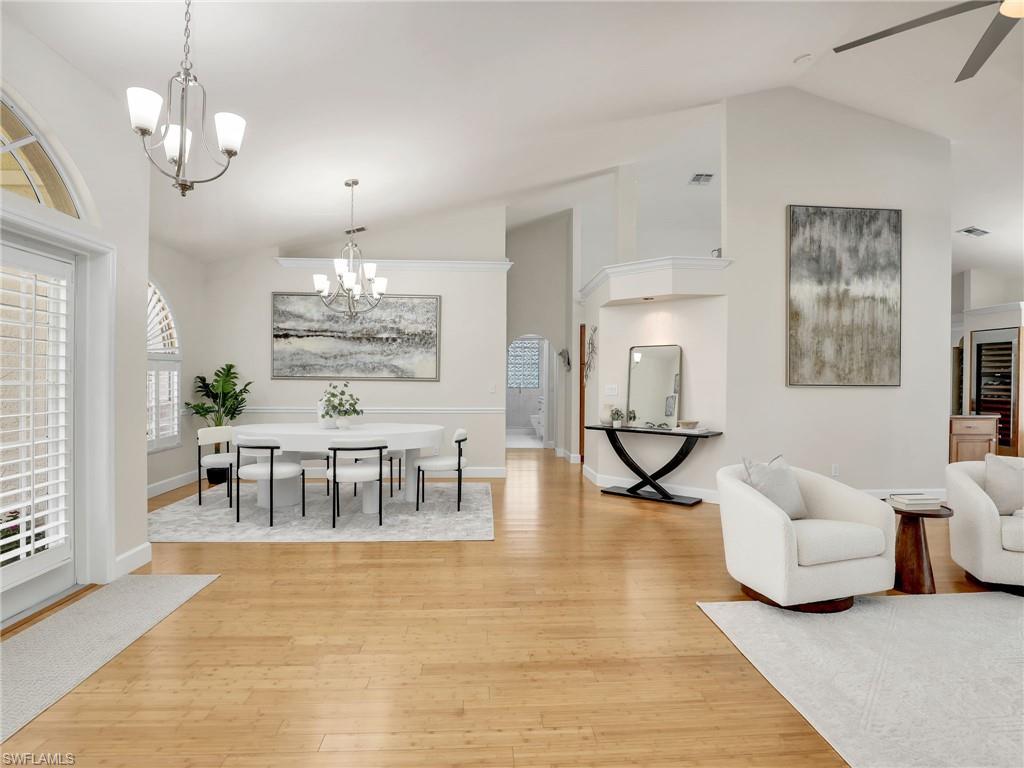 6862 Mill Run Road Naples, FL 34109 - Photo 3 of 50 Living room with ceiling fan, light hardwood / wood-style flooring, and built in features
