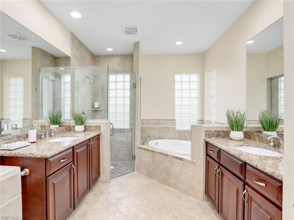 6862 Mill Run Road Naples, FL 34109 - Photo 31 of 50 Office area featuring ceiling fan, built in desk, and light hardwood / wood-style floors