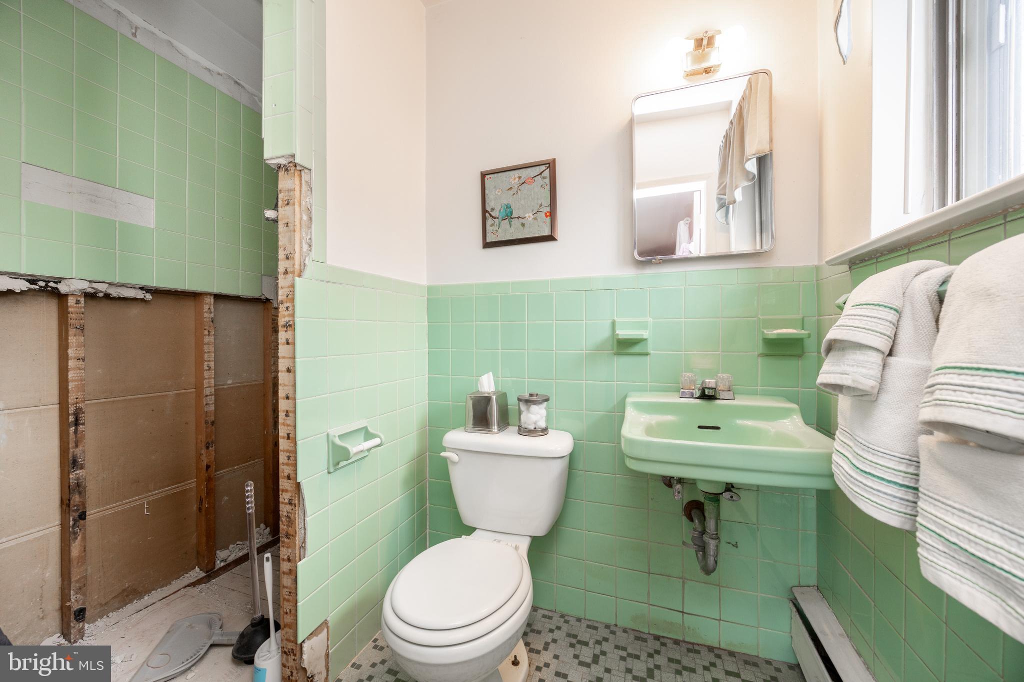 149 Conestoga Road Malvern, PA 19355 - Photo 20 of 43 a bathroom with a toilet sink and mirror