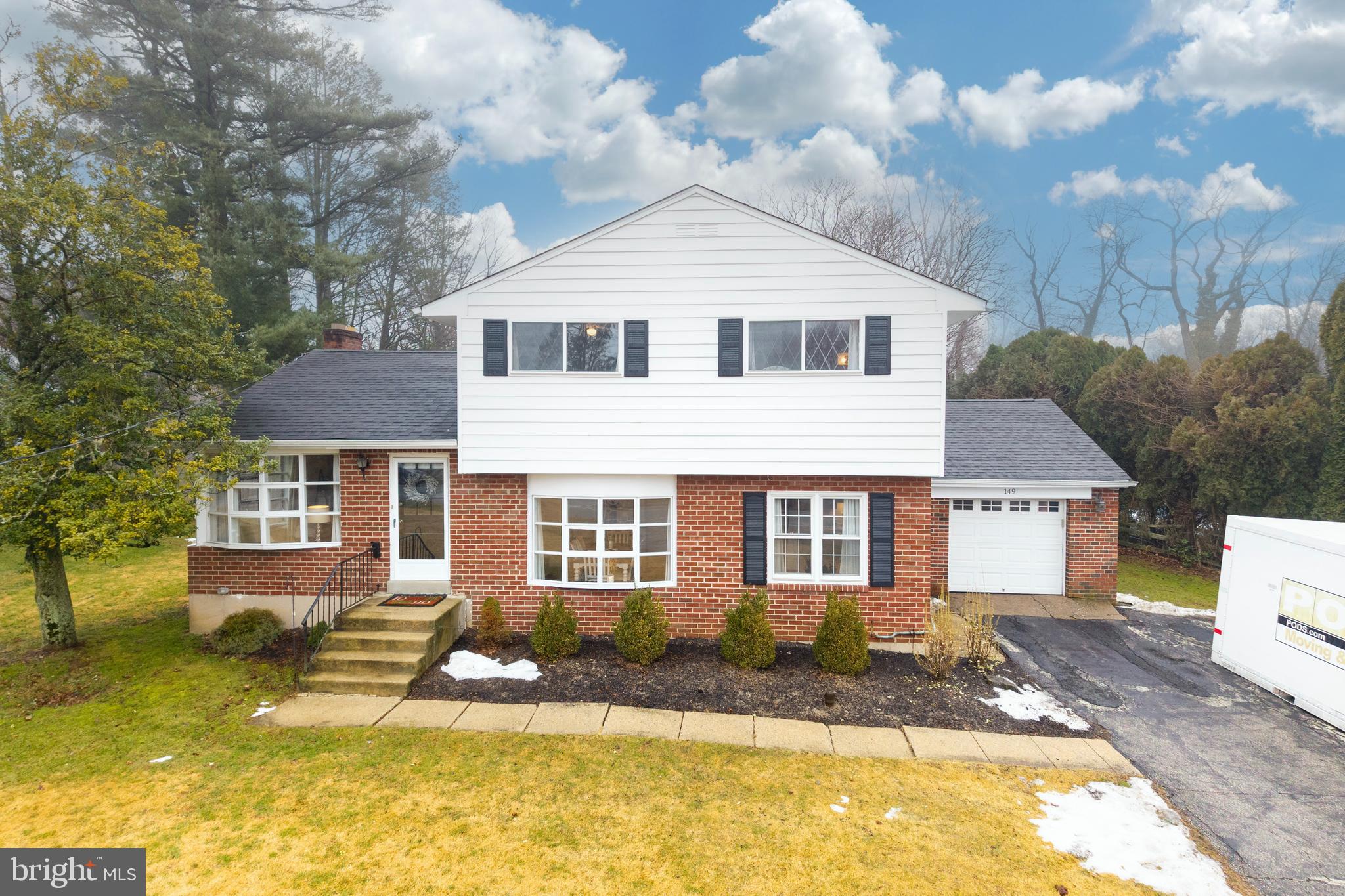 149 Conestoga Road Malvern, PA 19355 - Photo 2 of 43 a front view of a house with a yard