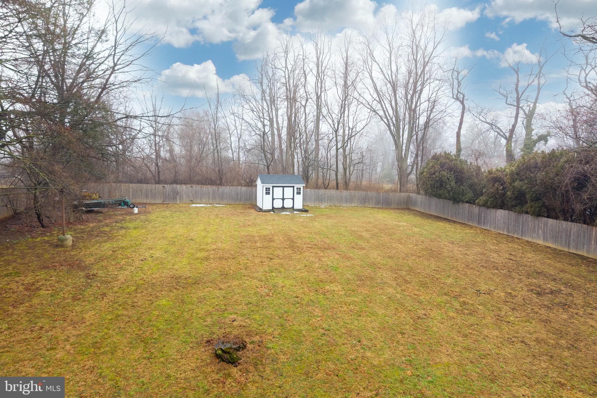 149 Conestoga Road Malvern, PA 19355 - Photo 29 of 43 a view of a swimming pool with an outdoor space and seating area