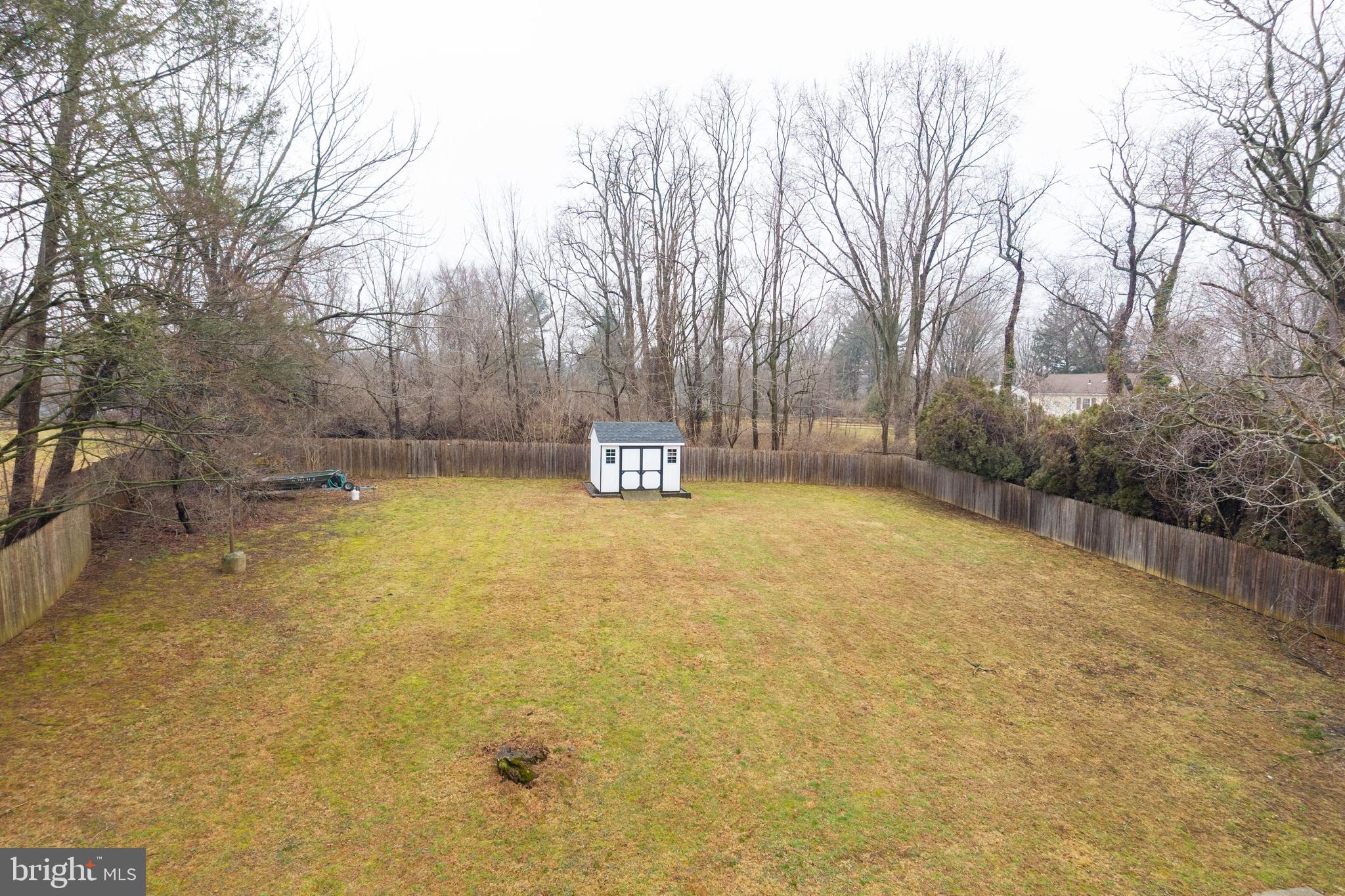 149 Conestoga Road Malvern, PA 19355 - Photo 41 of 43 a view of a swimming pool with an outdoor space and seating area