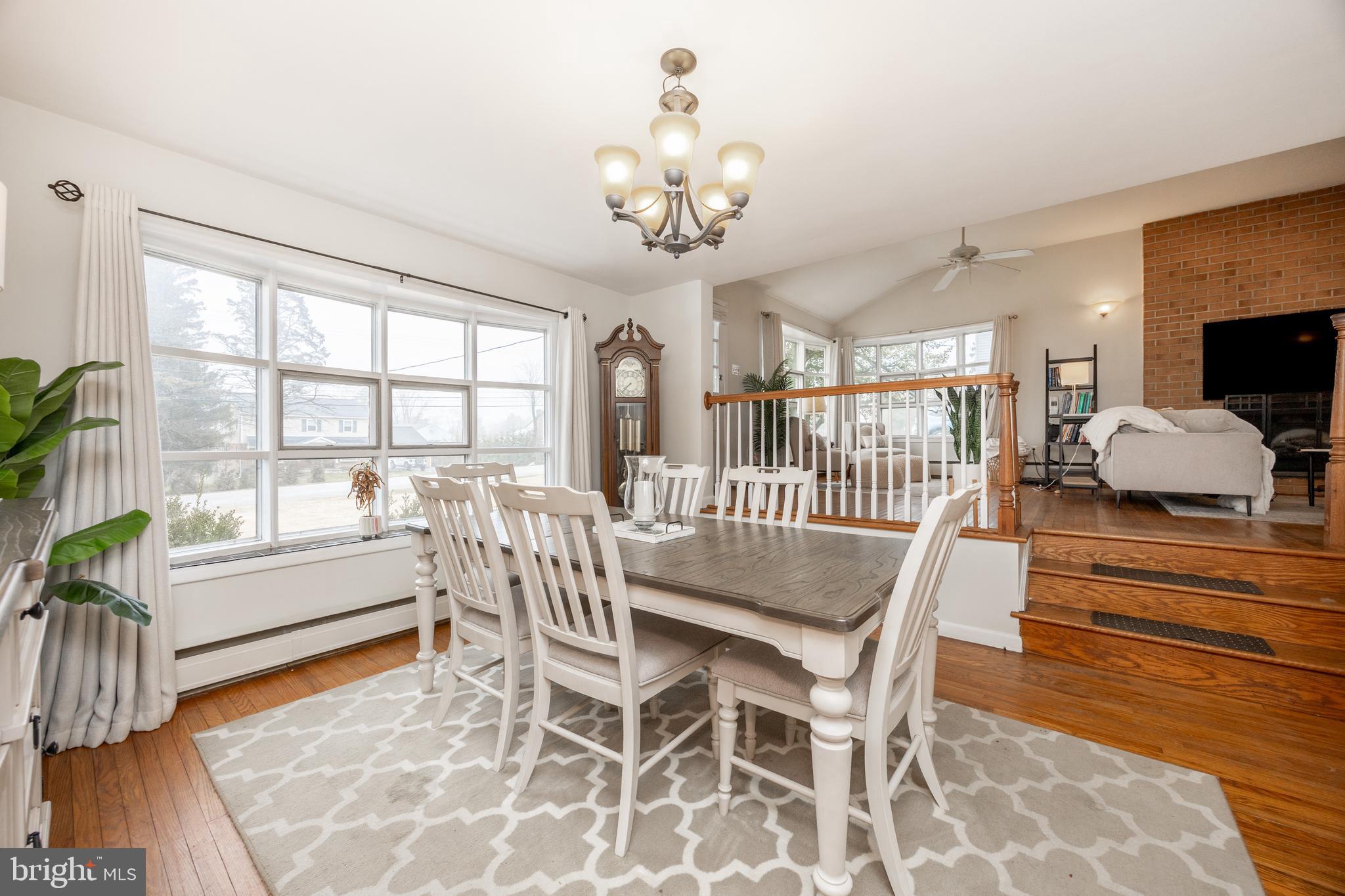 149 Conestoga Road Malvern, PA 19355 - Photo 5 of 43 a dining room with wooden floor and large windows