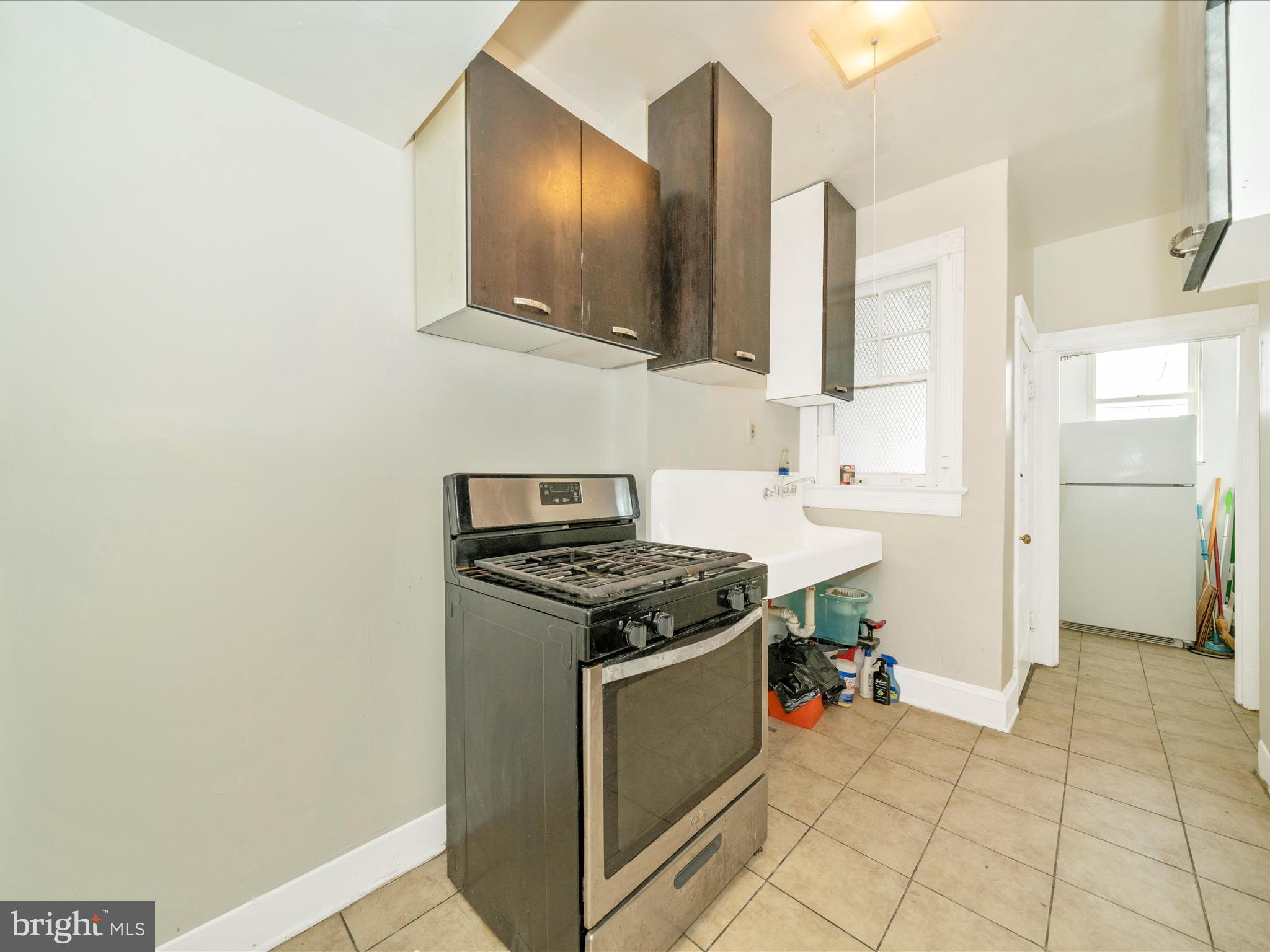 4818 7th Street Northwest Washington, DC 20011 - Photo 11 of 31 a kitchen with stainless steel appliances granite countertop a stove and a sink