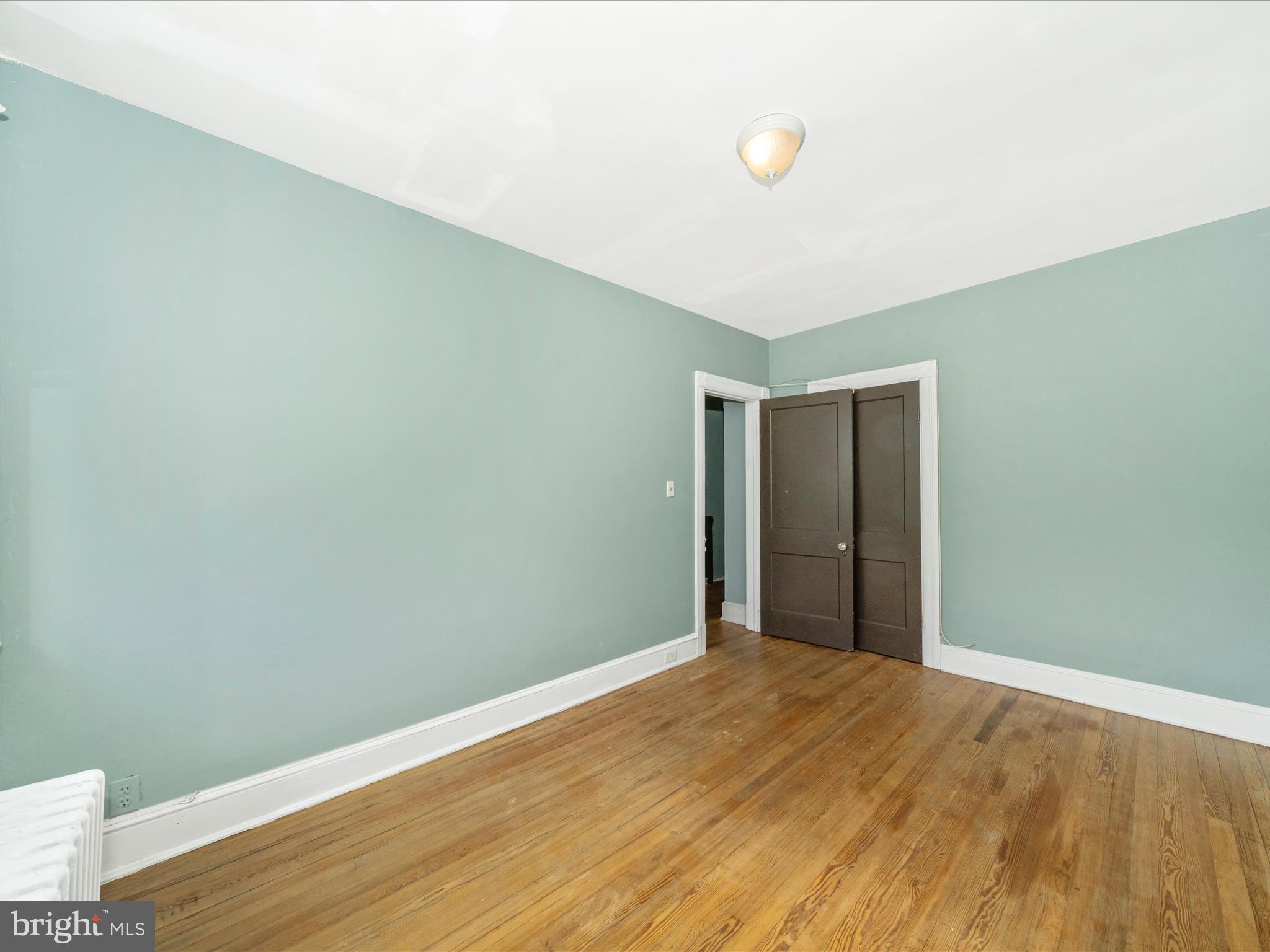 4818 7th Street Northwest Washington, DC 20011 - Photo 14 of 31 a view of a big room with wooden floor and windows