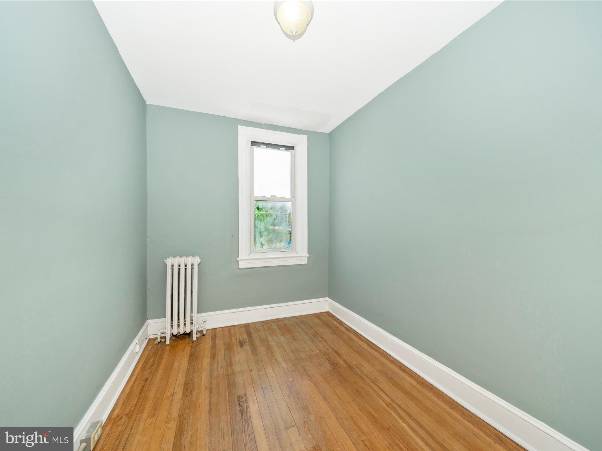 4818 7th Street Northwest Washington, DC 20011 - Photo 15 of 31 a view of room with window and wooden floor