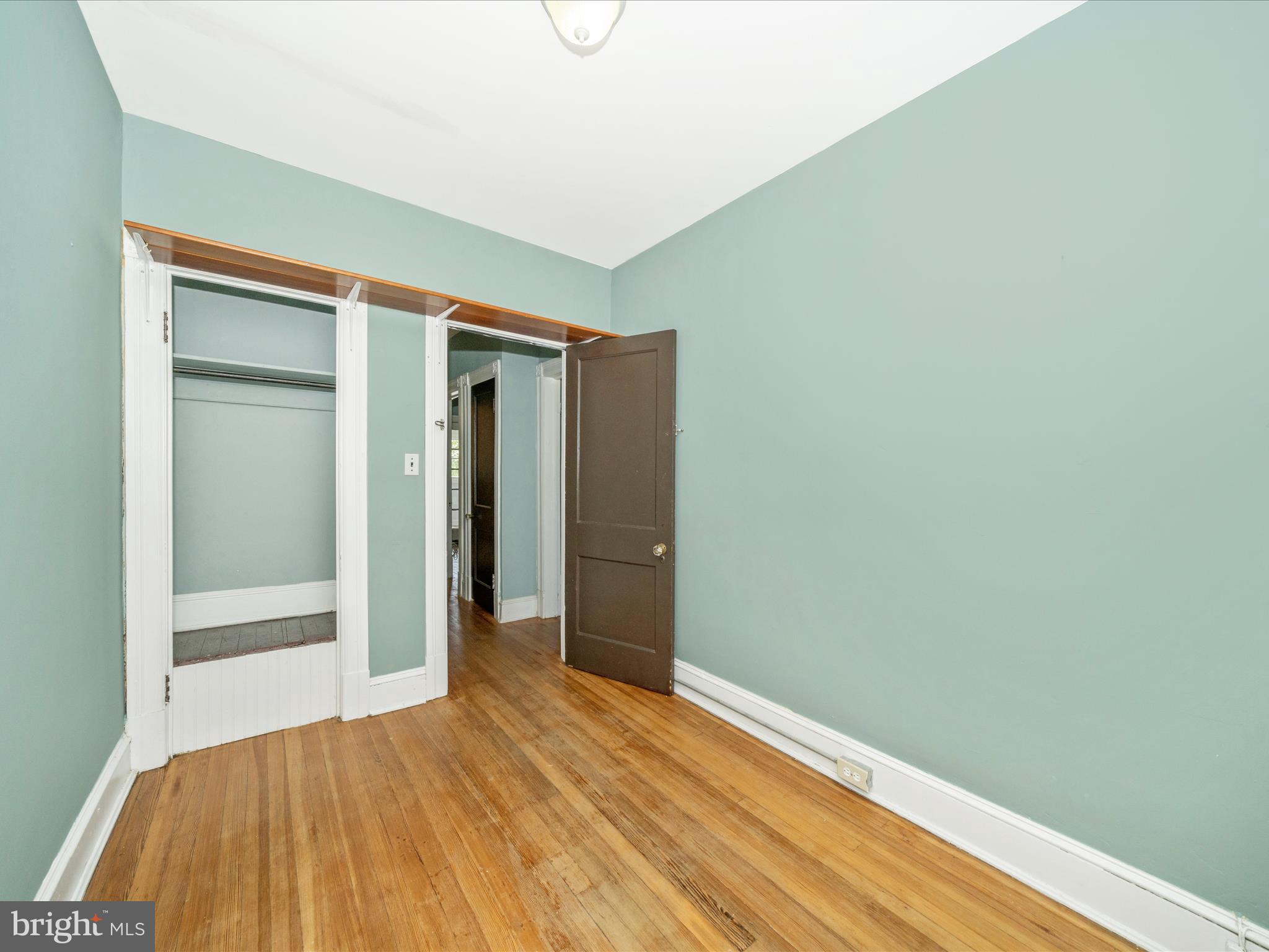 4818 7th Street Northwest Washington, DC 20011 - Photo 16 of 31 a view of an empty room with wooden floor and closet