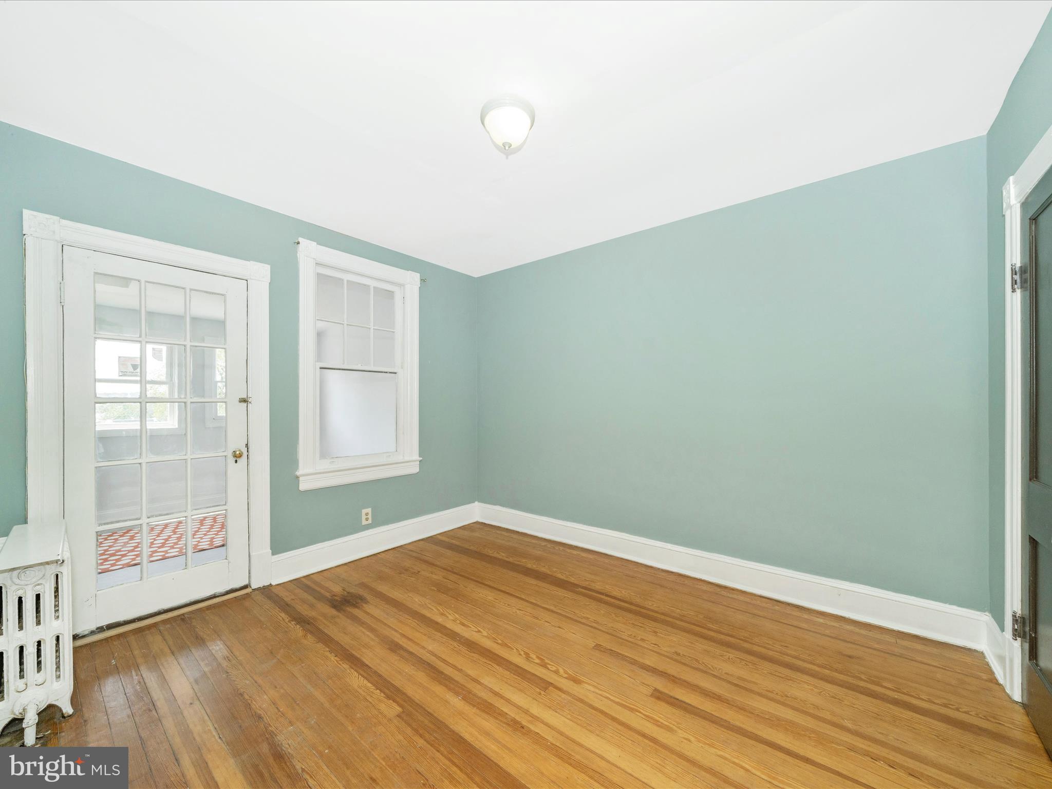 4818 7th Street Northwest Washington, DC 20011 - Photo 18 of 31 a view of empty room with wooden floor and fan