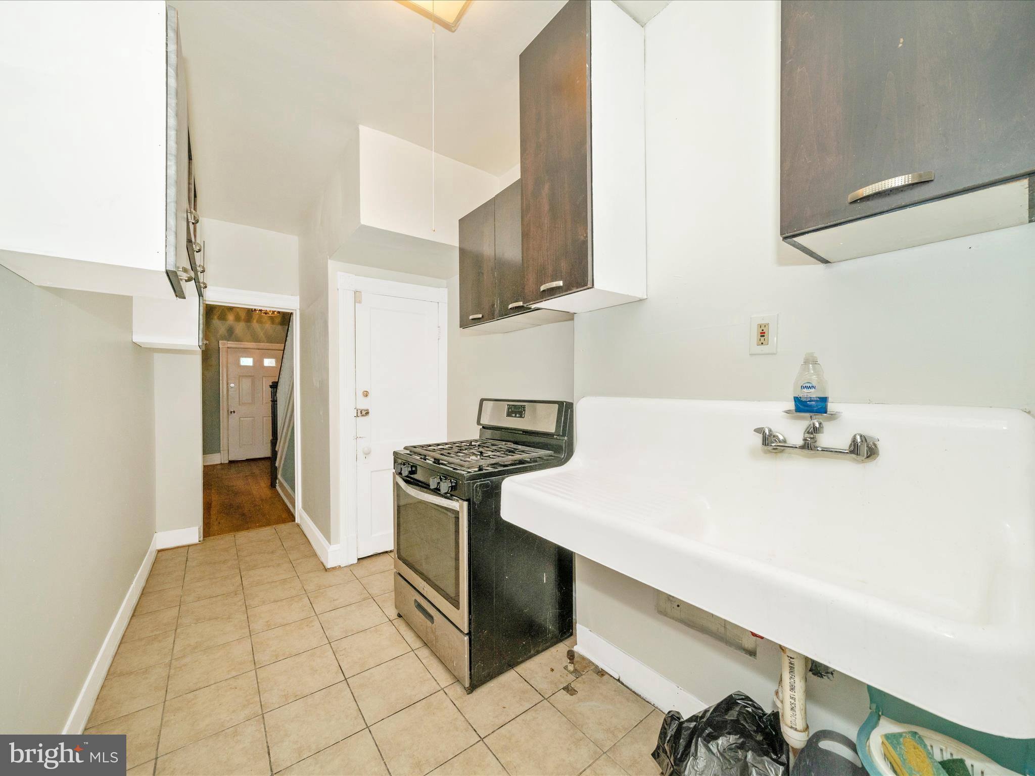 4818 7th Street Northwest Washington, DC 20011 - Photo 10 of 31 a kitchen with a sink cabinets and appliances