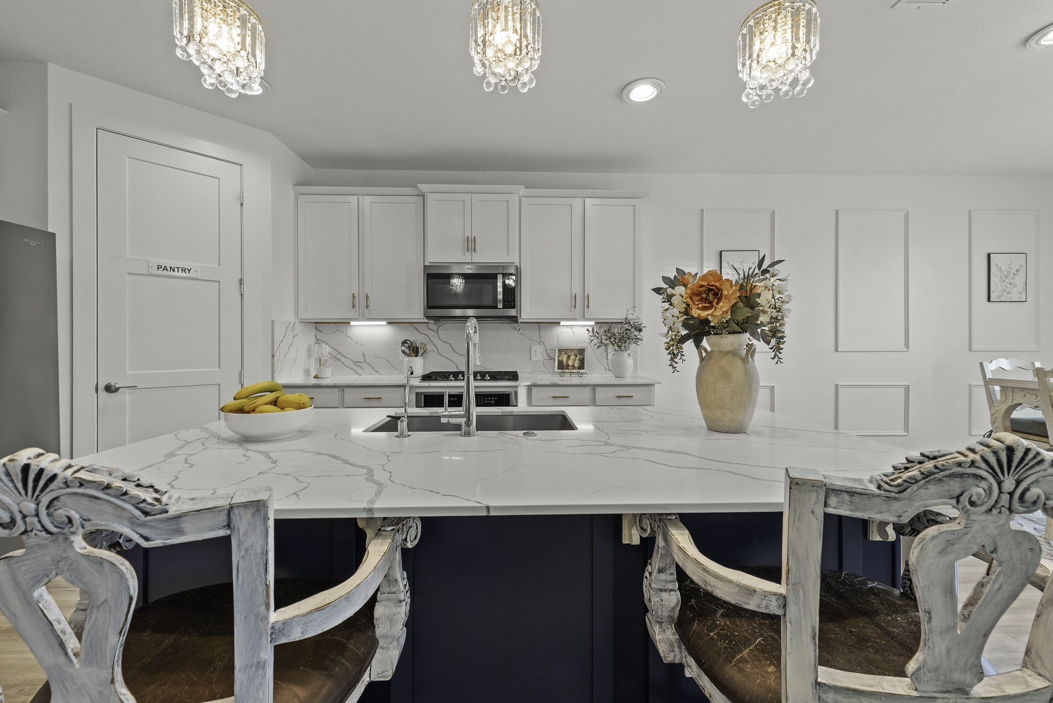 14130 Savage River Conroe, TX 77384 - Photo 13 of 33 a kitchen with a table chairs and a stove