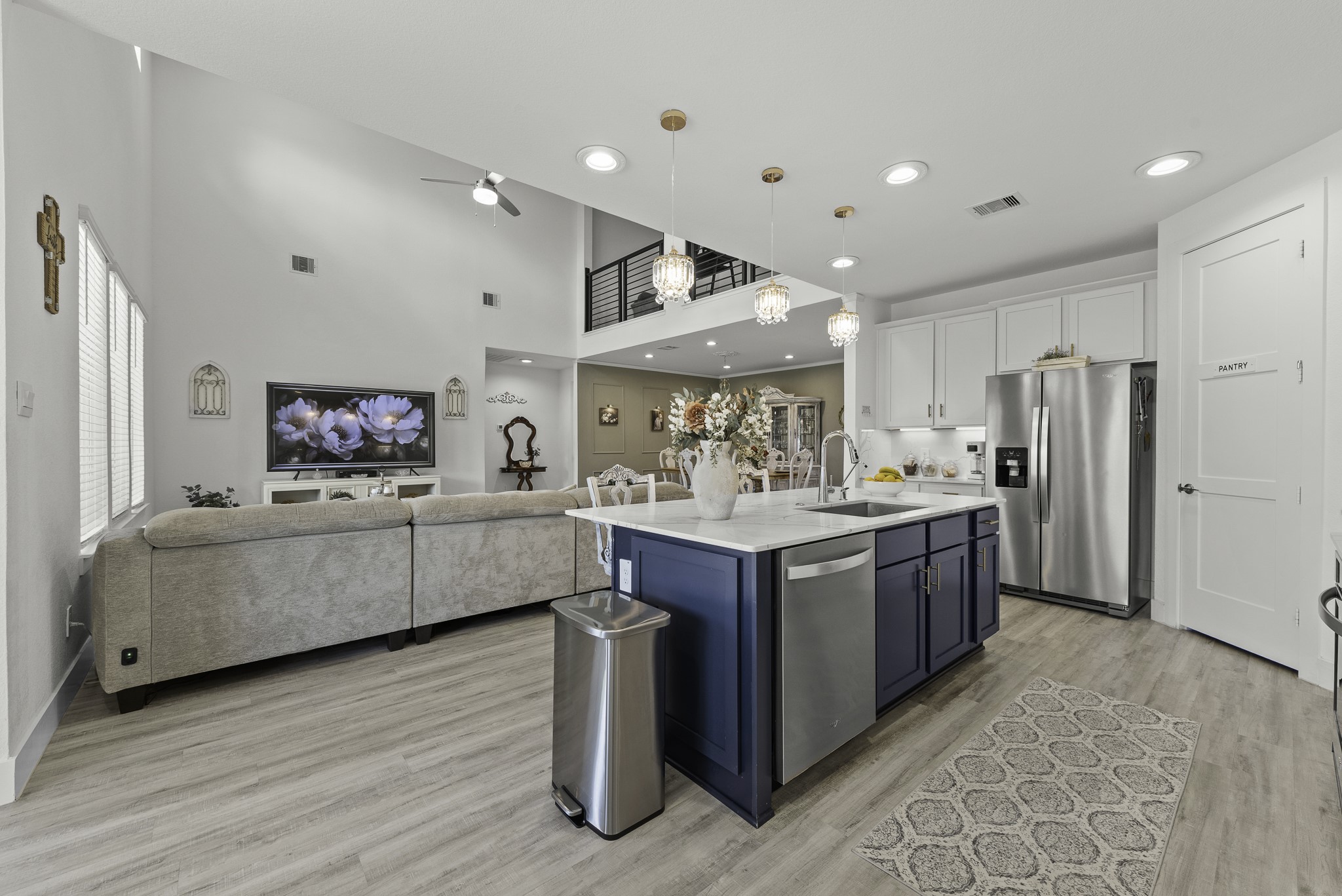 14130 Savage River Conroe, TX 77384 - Photo 15 of 33 a kitchen with stainless steel appliances kitchen island granite countertop a refrigerator a sink and a stove