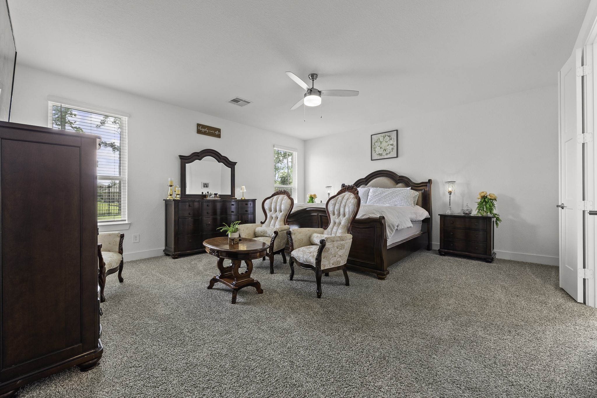 14130 Savage River Conroe, TX 77384 - Photo 17 of 33 a living room with furniture a table and a refrigerator