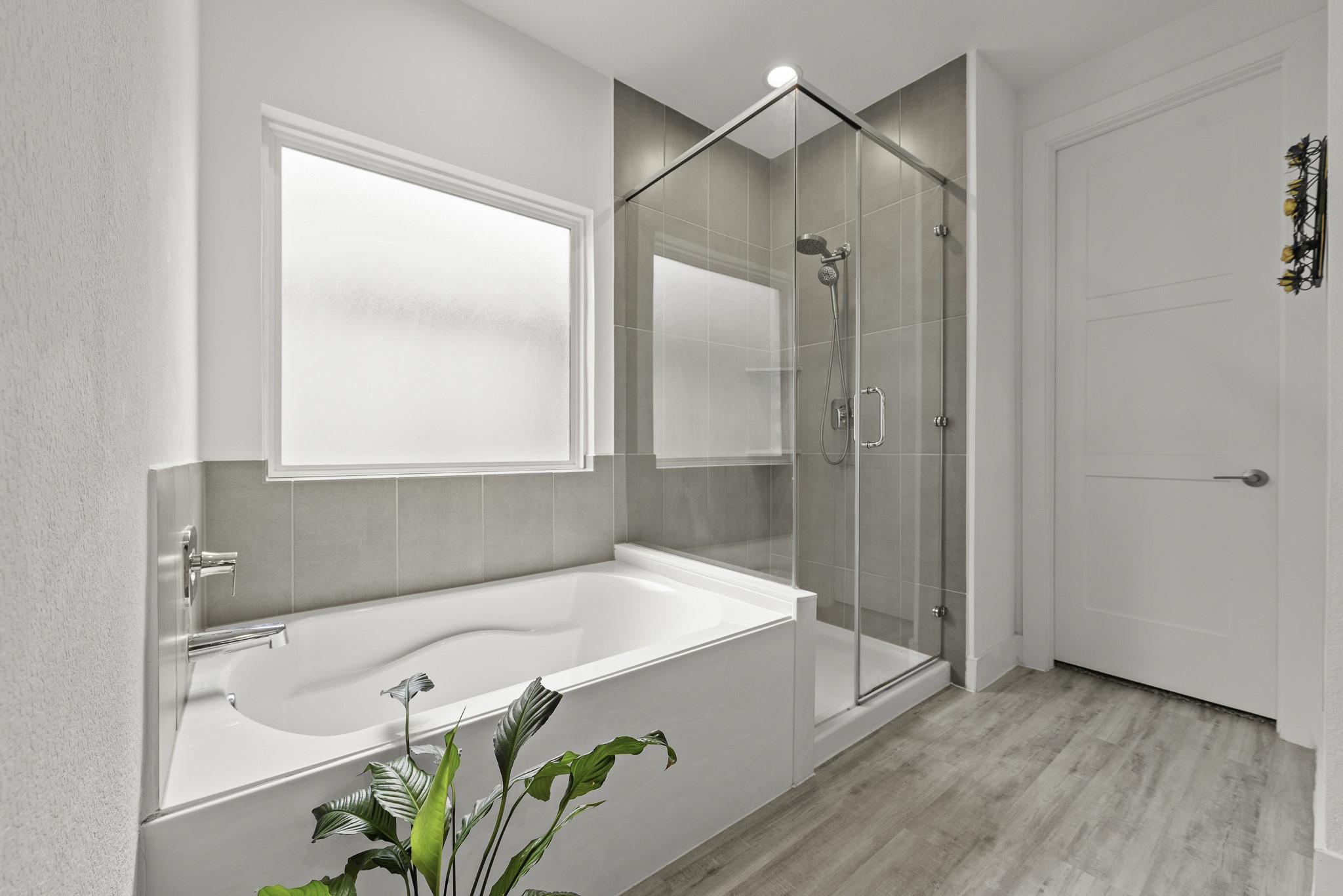 14130 Savage River Conroe, TX 77384 - Photo 20 of 33 a bathroom with a tub and shower