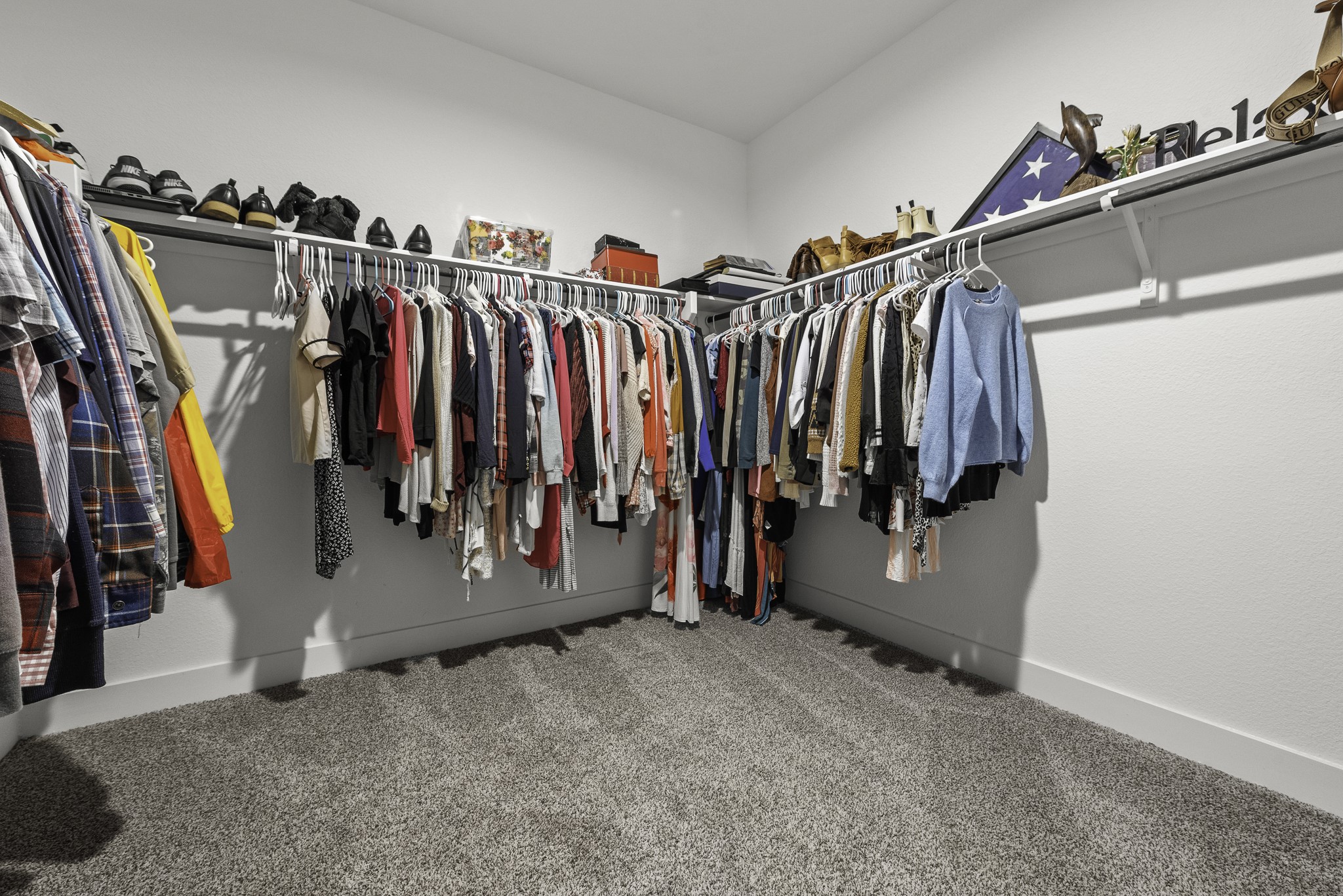 14130 Savage River Conroe, TX 77384 - Photo 22 of 33 a view of walk in closet with clothes