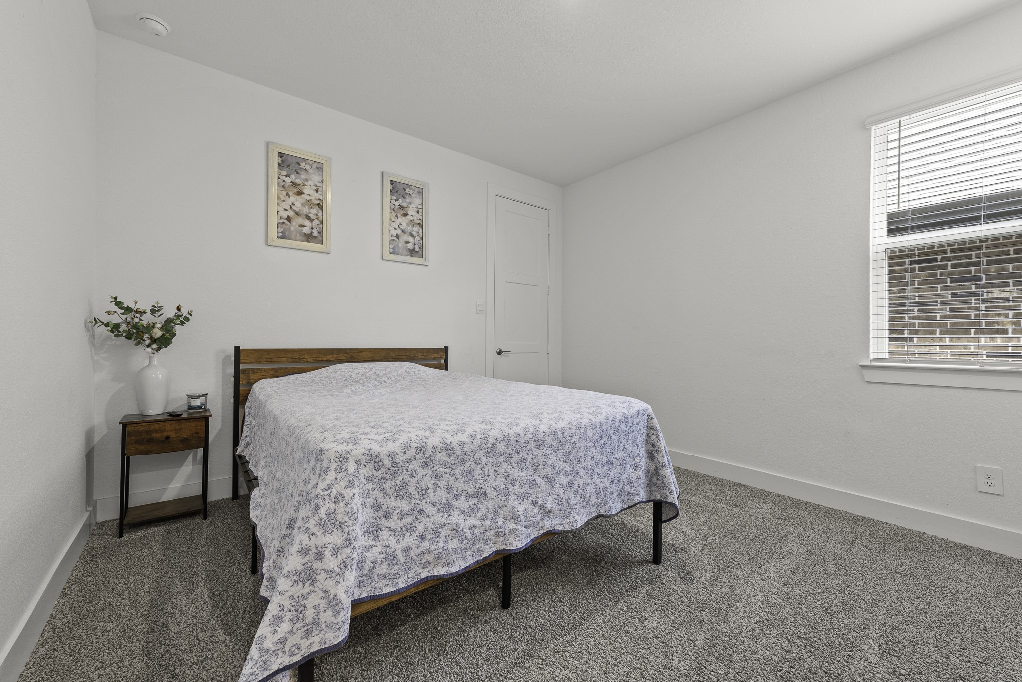 14130 Savage River Conroe, TX 77384 - Photo 23 of 33 a bedroom with a bed and window