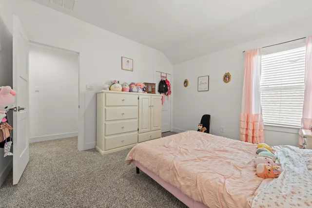 a bedroom with a bed and a cabinets