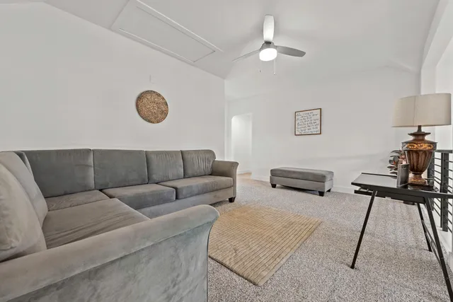 a living room with furniture and a table