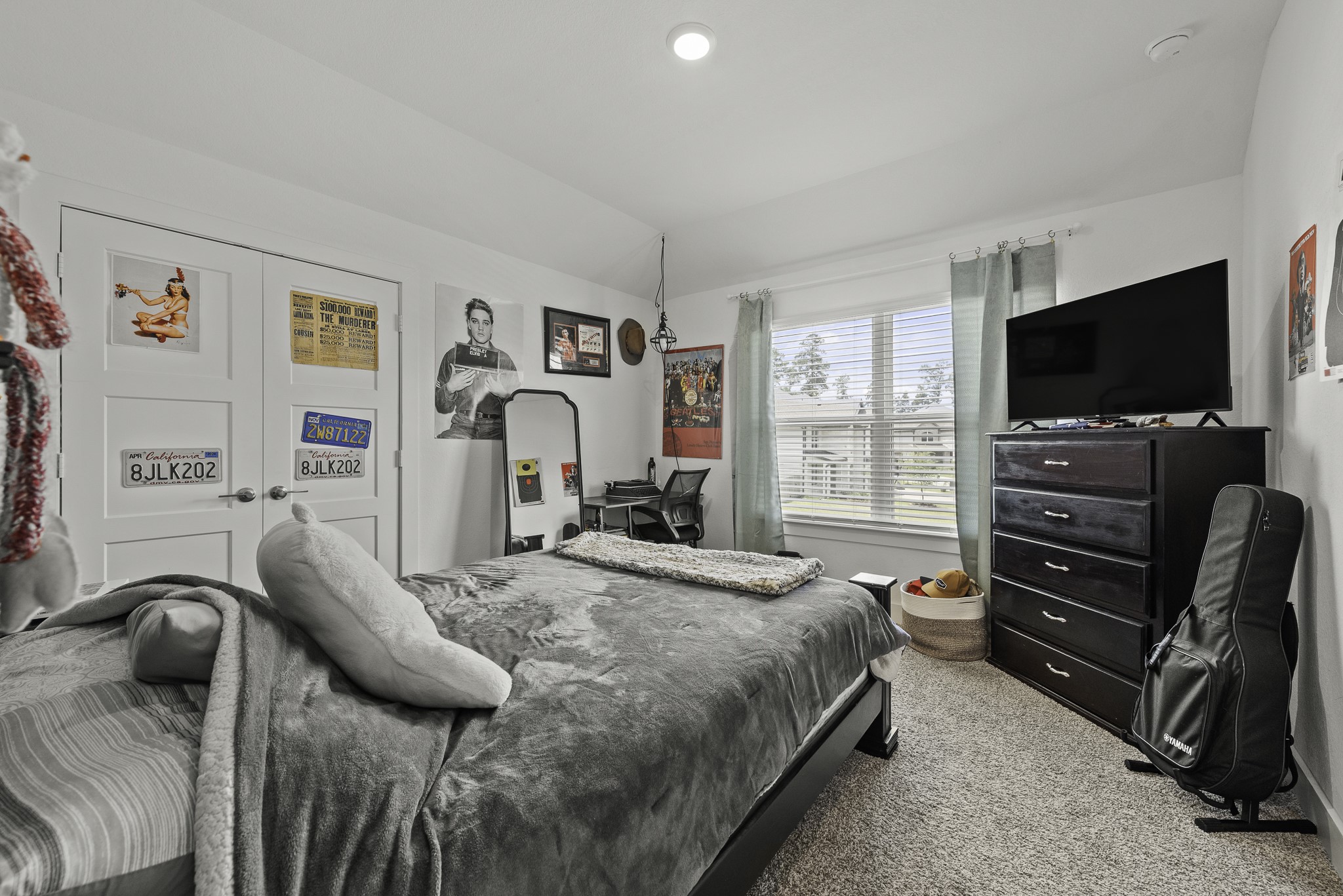 14130 Savage River Conroe, TX 77384 - Photo 29 of 33 a bedroom with a bed and a flat screen tv