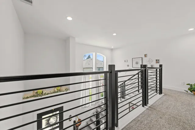 a view of a hallway with seating area