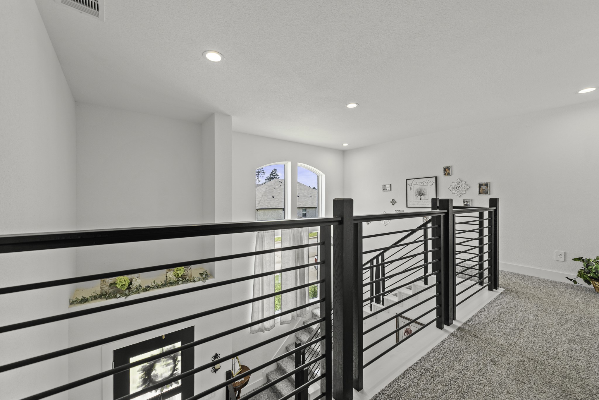 14130 Savage River Conroe, TX 77384 - Photo 30 of 33 a view of a hallway with seating area