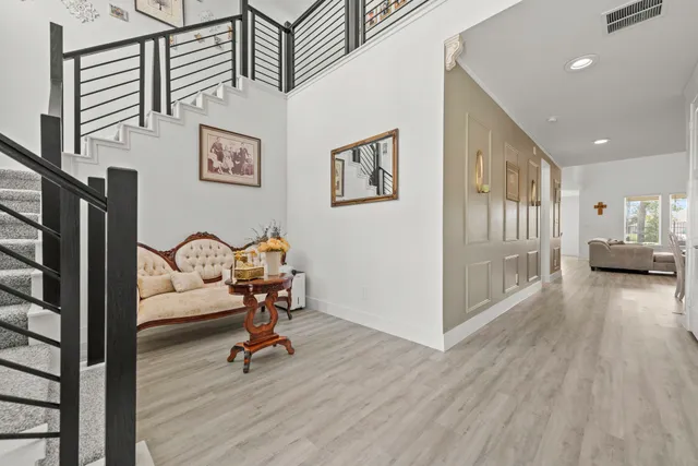 a view of a livingroom with furniture and a ceiling fan