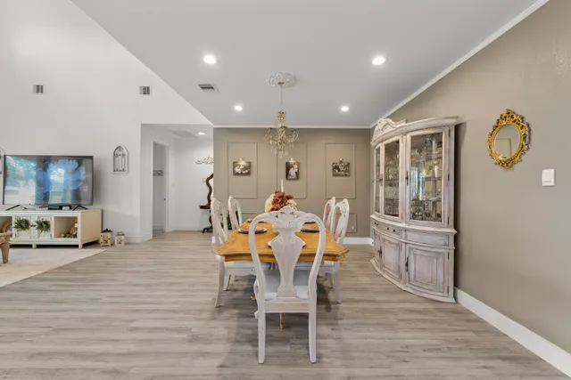 a dining room with furniture and window