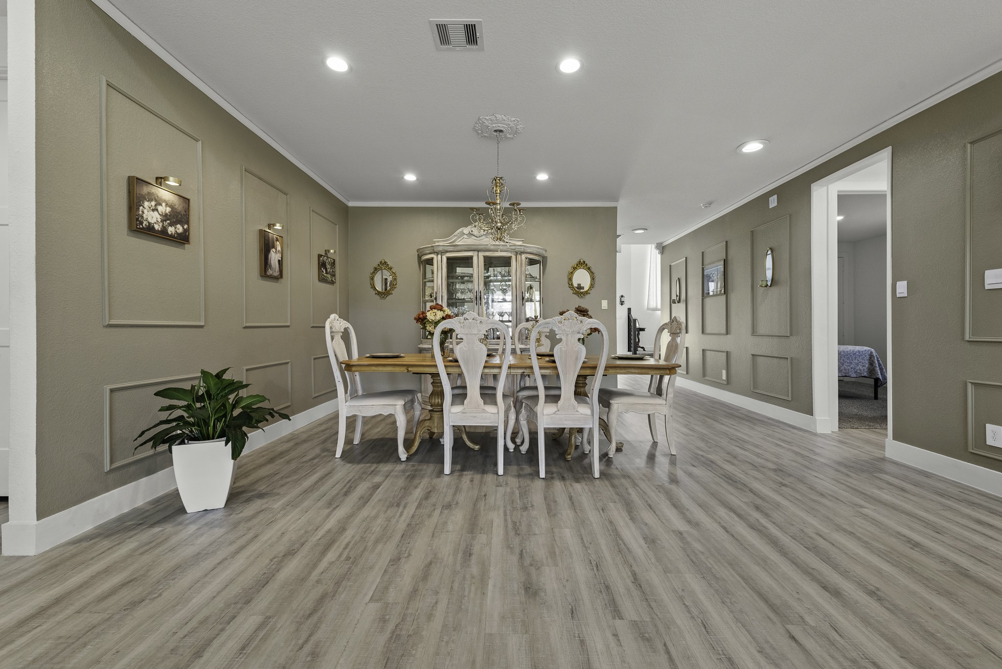 14130 Savage River Conroe, TX 77384 - Photo 8 of 33 a view of a dining room with furniture and wooden floor